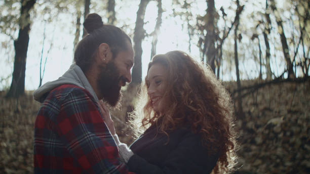 istock Loving couple cuddling on autumn day in forest 1127487695