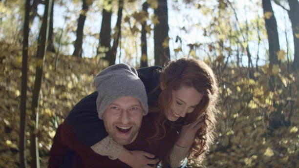 istock Loving couple cuddling on autumn day in forest 1127487699