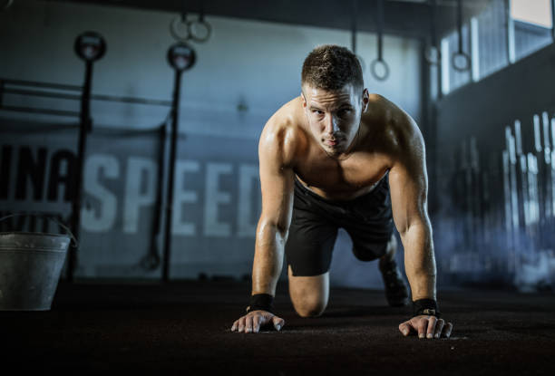 istock Sweaty male athlete having gym training in a gym. 1127487886