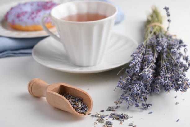 istock Lavender tea and lavender donut 1127487957