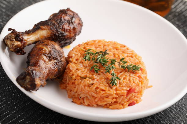 Nigerian Jollof Rice with chicken thigh stock photo