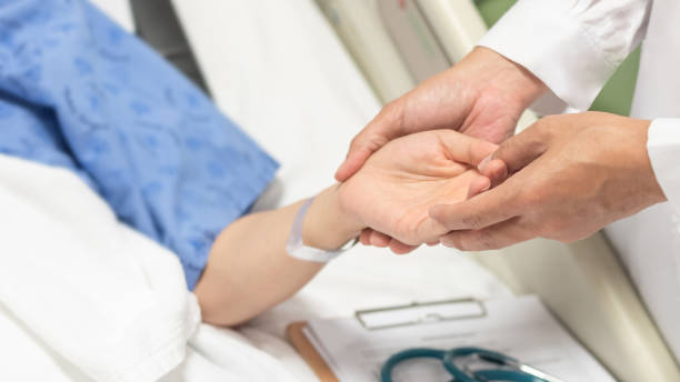 Patient on bed with doctor holding hands for nursing, medical health care, caregiver and in-patient ward healthcare concept Patient on bed with doctor holding hands for nursing, medical health care, caregiver and in-patient ward healthcare concept inpatient stock pictures, royalty-free photos & images