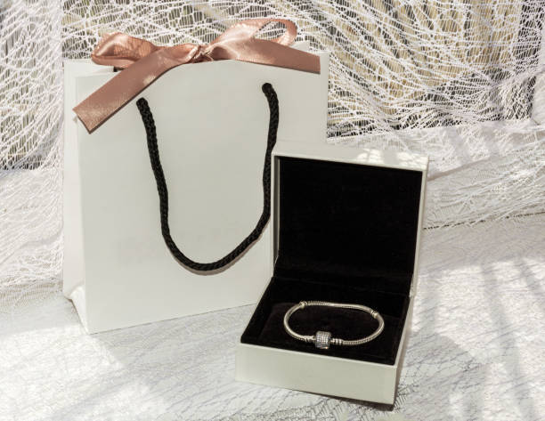 istock Bracelet in a gift box. Gift bag with ribbon. 1127488314