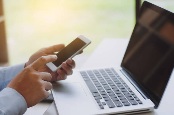 istock male hands using mobile smart phone for payment and entertainment. 1127489706