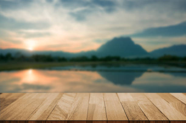 istock wood tabletop with blurred amazing landscape background. 1127489723