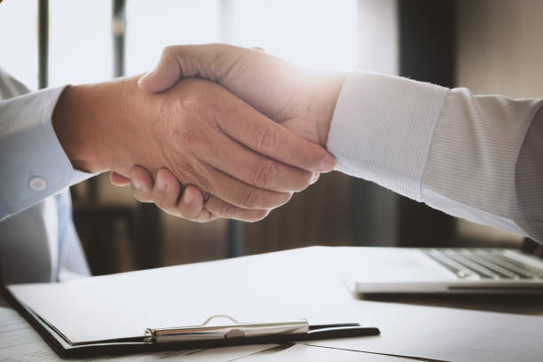 istock recruitment and interview concept , candidate with human resource manager handshaking. 1127489748