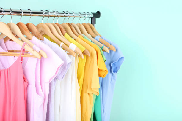 istock Fashion dresses hanging on mint background 1127490432