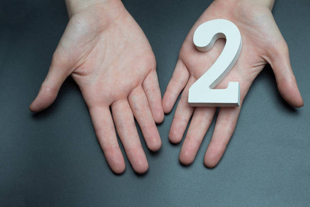 istock On the women's palms number two. 1127492598