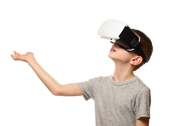 istock Boy experiencing virtual reality arm outstretched in front of him. Isolate on white background. Technology concept 1127492740