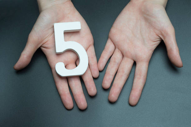 istock On the female palms figure five. 1127493494