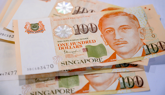 A close-up of a Singapore 100 dollar bill.