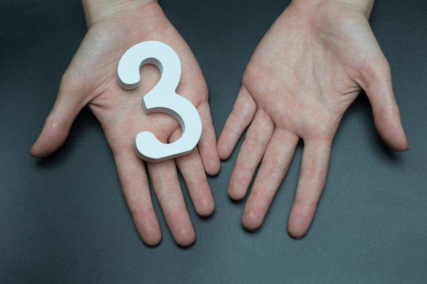 istock On the female palms figure three. 1127493670