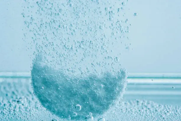 many bubbles of disintegrating pill in water