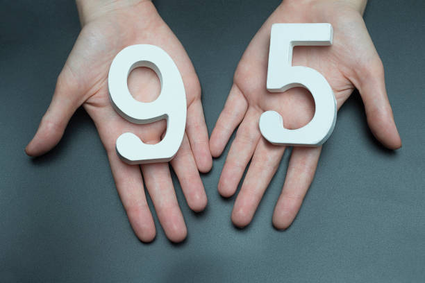 istock To female hands the figure of ninety-five. 1127496076