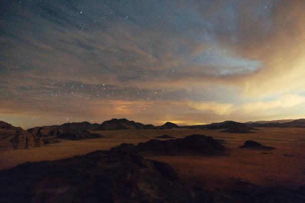 istock Scenic view of Wadi Rum desert at night 1127499119