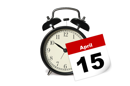 Tax day alarm clock note reminder calendar April 15