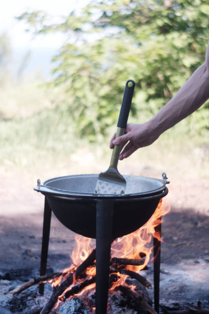 istock A man is cooking on fire on the nature 1127501895