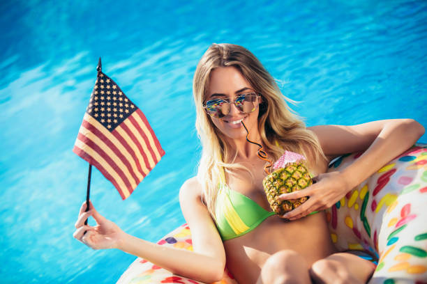 Woman relaxing on inflatable ring donut in the pool