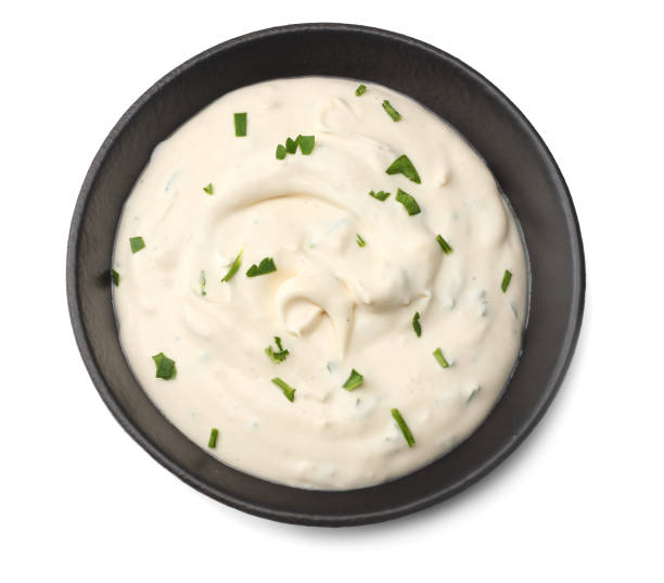 istock garlic sauce in black bowl isolated on white background. top view 1127503202