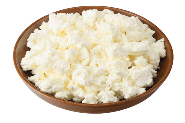 istock cottage cheese in brown bowl isolated on white background 1127503364