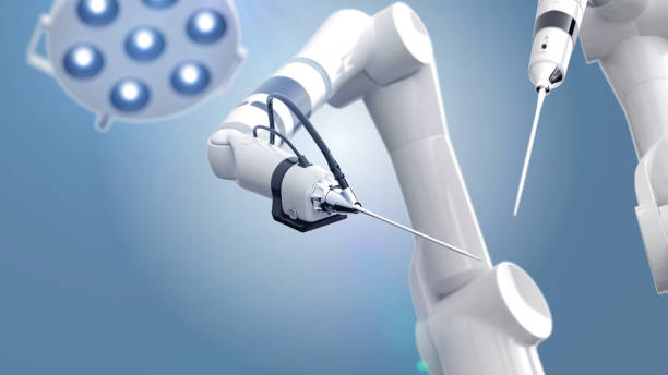 due bracci di chirurgo robot e un tavolo operatorio con una luce - chirurgia robotica foto e immagini stock