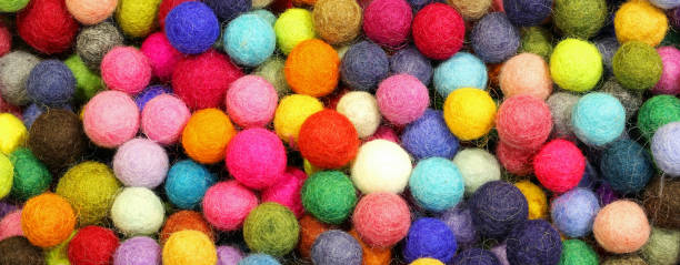 istock background of little balls made with wool 1127506355