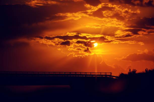 istock clouds in the sky and the rays of the sun. sunset, selective focus. 1127508288
