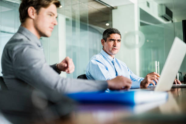 Businessmen discussing in meeting at table
