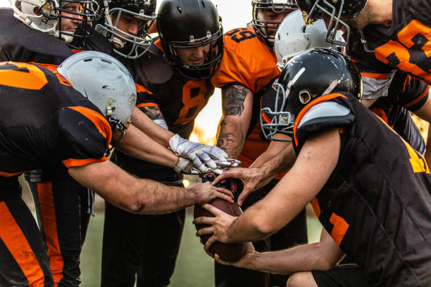 Football Team starting match American Football Players Starting Match At Stadium, high angle view american football sport photos stock pictures, royalty-free photos & images