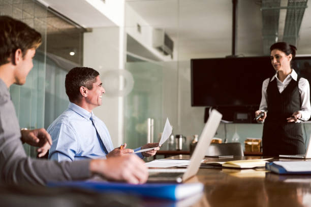 istock Businesswoman giving presentation in board room 1127511092
