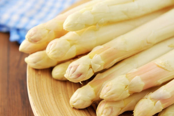 istock fresh buddle of white asparagus. uncooked. 1127513559