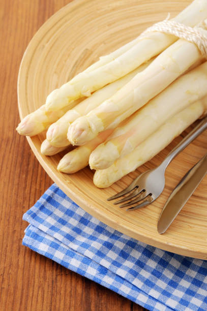 istock fresh buddle of white asparagus. uncooked. 1127513572