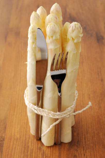 istock fresh buddle of white asparagus. uncooked. 1127513581