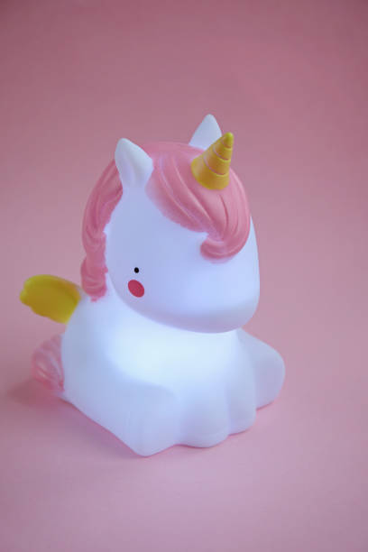 istock Unicorn light home decor on pink background 1127515761