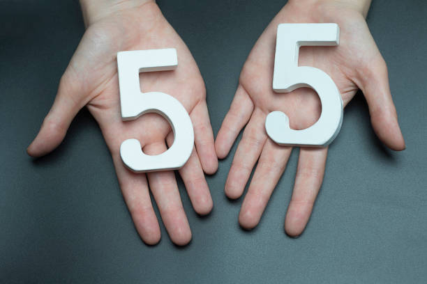 istock On the female palms figure fifty-five. 1127517991