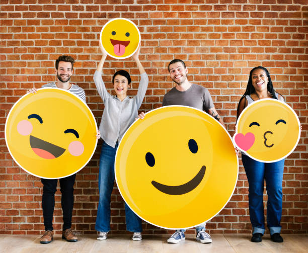 istock Diverse people holding positive emoticons 1127518041