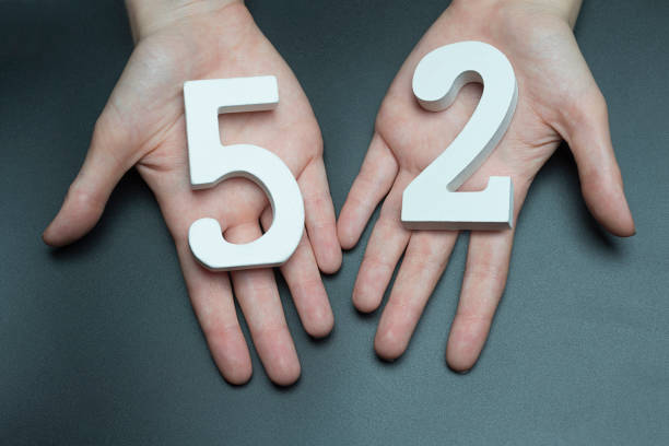 istock On the female palms figure fifty-two. 1127518056