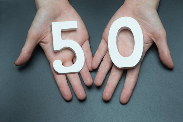 istock On the female palms figure fifty. 1127518934