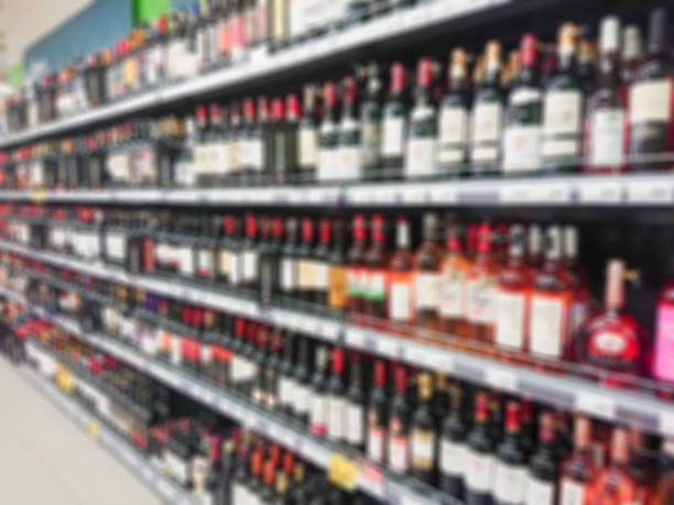 istock Abstract blurred image. Defocused lens. Wine, cognac and other alcoholic beverages on the shelves in the supermarket 1127519254