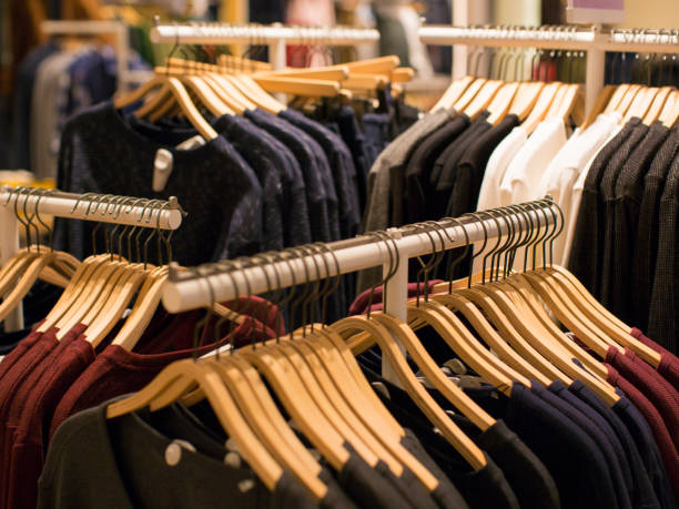 istock Hangers with different clothes in wardrobe closet 1127520392