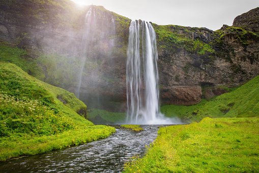 Beautiful and famous Seljalandsfoss Waterfall close to Route 1. The waterfall is around 60m high and is part of the Seljalands River which has its origin in the volcano glacier Eyjafjallajökull.  Route 1, Southern Iceland, Iceland