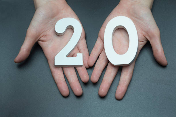istock On the female palms figure twenty. 1127520778
