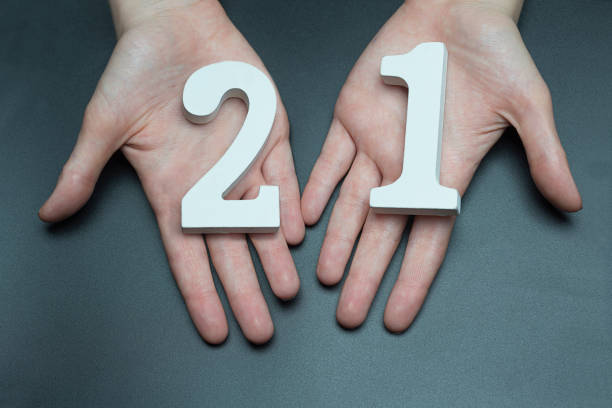 istock On the female palms figure twenty-one. 1127520882