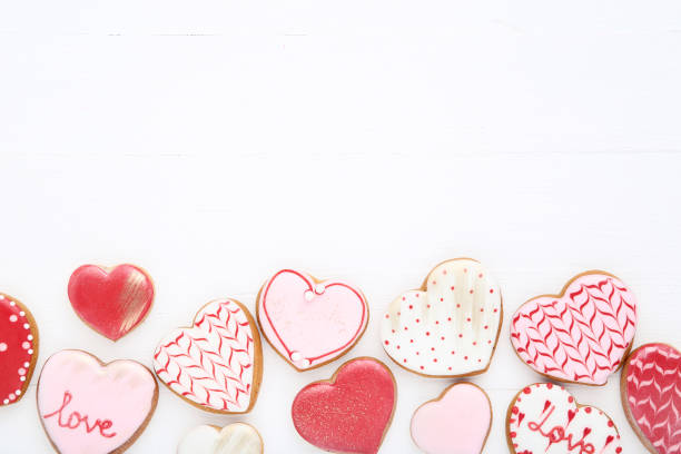 istock Valentine day heart shaped cookies on white wooden table 1127521063