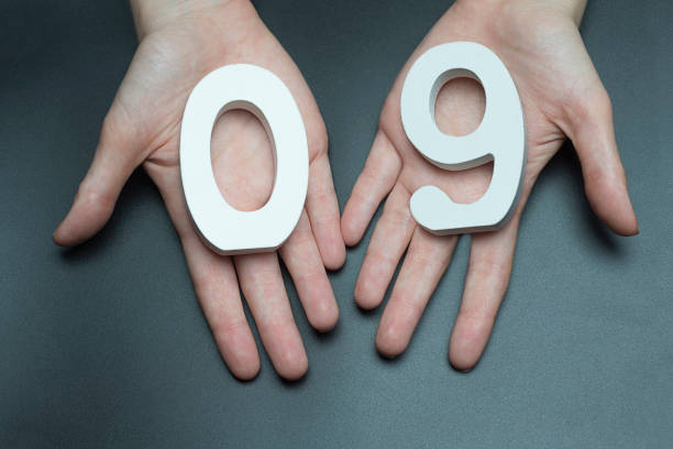 istock On the palms the number zero and nine. 1127522451