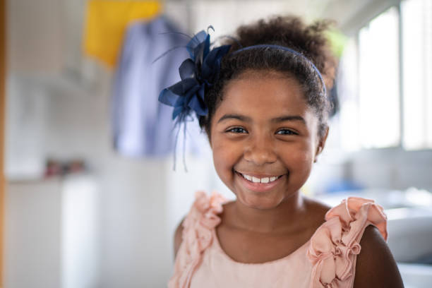 Afro latino girl child portrait at laundry Childhood afro latinx ethnicity stock pictures, royalty-free photos & images