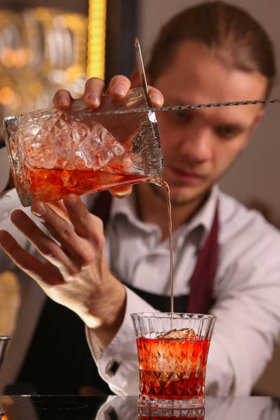 istock Barmen making negroni alcohol cocktail 1127525166