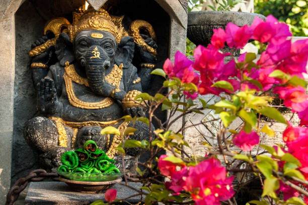 istock Ganesha and tempting pancakes 1127528784