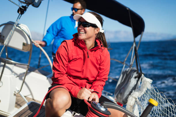 istock Attractive strong woman sailing with her boat 1127532020
