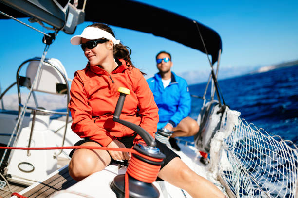 istock Attractive strong woman sailing with her boat 1127532029
